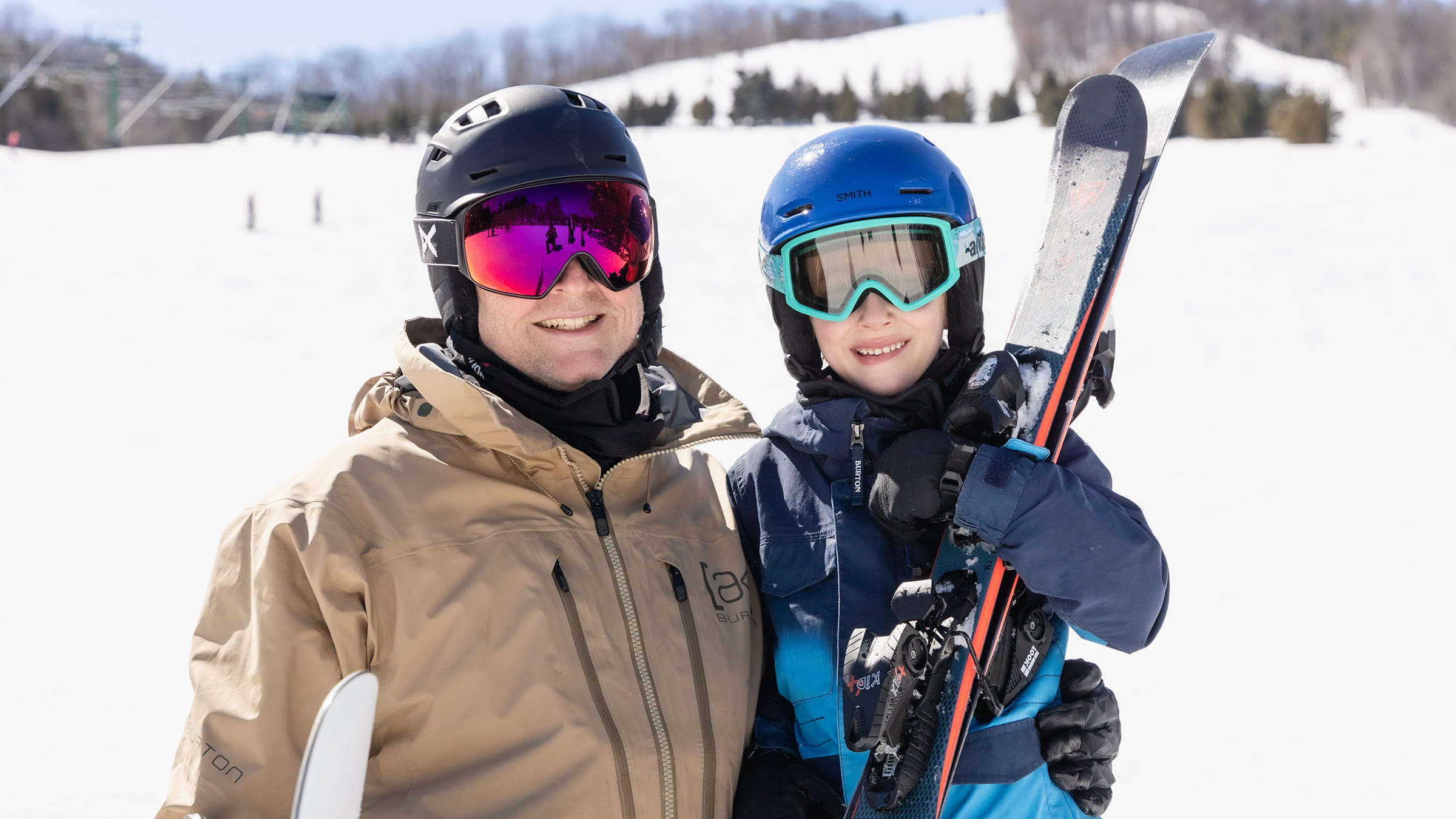 father and son skiing at blue mountain